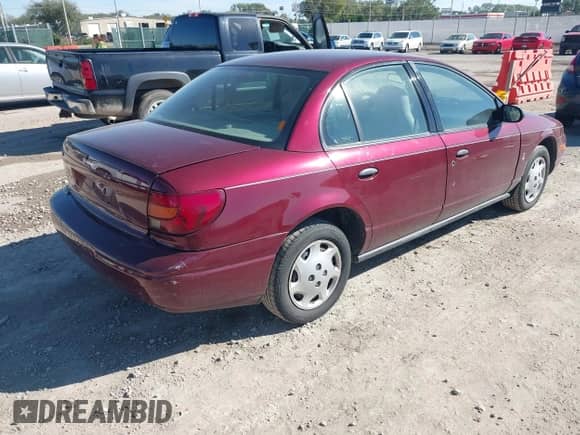 2002 Saturn SL z VIN 1G8ZH52862Z120636, wystawiony jako IAAI lot #43459366 z przebiegiem 73 742 mil mil oraz . Historia ofert i sprzedaży dostępna na DreamBid. Obrazek 4.