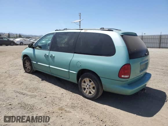 1996 Dodge Caravan LE with VIN 1B4GP54L2TB415788, listed as a Copart auction lot 61876575 with 136,500 mi miles and Salvage title. Bid and sale history available at DreamBid. Image 2.