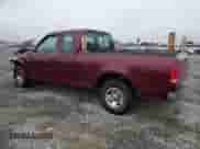 2003 Ford F-150 XL with VIN 1FTRX17283NA09956, listed as a Copart auction lot 81526395 with 195,707 mi miles and Salvage title. Bid and sale history available at DreamBid. Image 2.