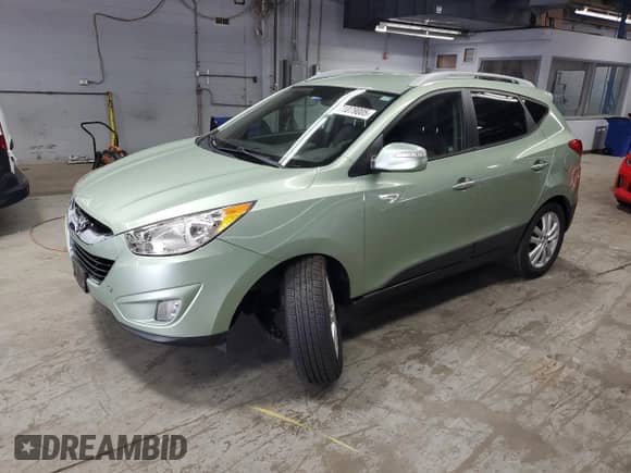 2011 Hyundai Tucson GLS with VIN KM8JU3ACXBU225908, listed as a Copart auction lot 71079005 with 114,646 mi miles and Salvage title. Bid and sale history available at DreamBid. Image 1.
