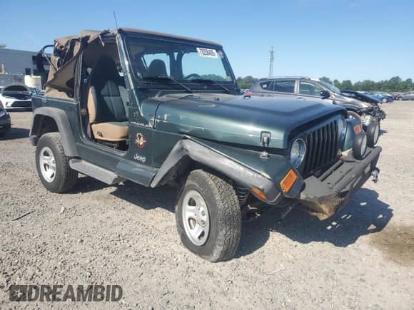 2002 Jeep Wrangler Sahara с VIN 1J4FA59S32P711205, выставлен на аукционе Copart как лот 70258405 с пробегом 117 004 миль миль и Списание • Salvage title. История ставок и продаж доступна на DreamBid. Изображение 4.
