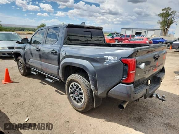 2024 Toyota Tacoma TRD Off Road with VIN 3TMLB5JN7RM003373, listed as a Copart auction lot 69316065 with 45,905 mi miles and Salvage title. Bid and sale history available at DreamBid. Image 2.