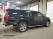 2015 Chevrolet Suburban LTZ с VIN 1GNSKKKC8FR120677, выставлен на аукционе Copart как лот 86426505 с пробегом 156 320 миль миль и Списание • Salvage title. История ставок и продаж доступна на DreamBid. Изображение 3.