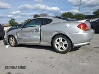 2003 Hyundai Tiburon GT with VIN KMHHN65F03U055237, listed as a Copart auction lot 82400615 with 244,468 mi miles and Salvage title. Bid and sale history available at DreamBid. Image 2.