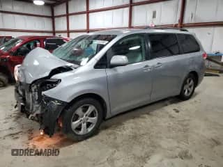 2012 Toyota Sienna LE with VIN 5TDKK3DC7CS184881, listed as a Copart auction lot 82403905 with 142,366 mi miles and Salvage title. Bid and sale history available at DreamBid. Image 1.