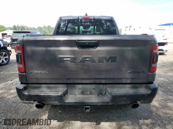 2023 Ram 1500 Rebel with VIN 1C6SRFLT1PN668899, listed as a Copart auction lot 66134035 with 12,995 mi miles and Clean title. Bid and sale history available at DreamBid. Image 6.