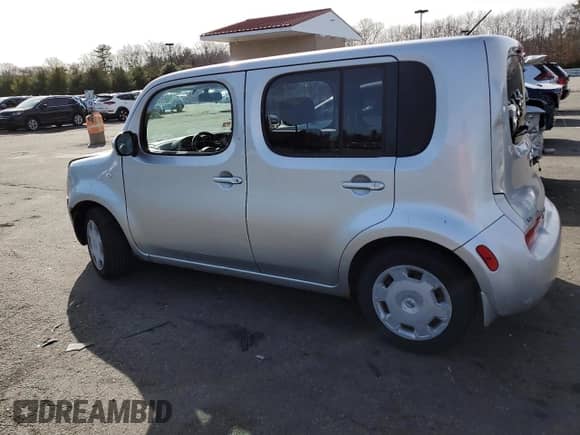 2013 Nissan Cube S with VIN JN8AZ2KR6DT301852, listed as a Copart auction lot 48990045 with 94,920 mi miles and Salvage title. Bid and sale history available at DreamBid. Image 2.