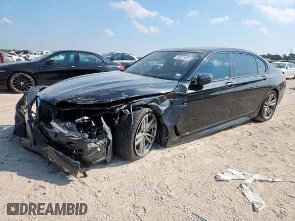 2016 BMW 7 Series 750i with VIN WBA7F0C53GGL99358, listed as a Copart auction lot 80313835 with 87,729 mi miles and Salvage title. Bid and sale history available at DreamBid. Image 1.