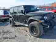 2021 Jeep Wrangler Unlimited Sahara z VIN 1C4HJXEG5MW595929, wystawiony jako IAAI lot #41379250 z przebiegiem 63 537 mil mil oraz . Historia ofert i sprzedaży dostępna na DreamBid. Obrazek 1.