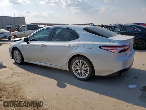 2019 Toyota Camry Hybrid LE с VIN 4T1B21HK2KU512025, выставлен на аукционе Copart как лот 80734415 с пробегом 106 463 миль миль и Списание • Salvage title. История ставок и продаж доступна на DreamBid. Изображение 2.