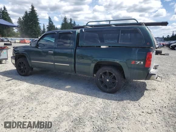 2005 Chevrolet Silverado 1500 Work Truck with VIN 2GCEK19V751279723, listed as a Copart auction lot 63413135 with 303,023 mi miles and Salvage title. Bid and sale history available at DreamBid. Image 2.