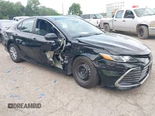 2022 Toyota Camry Hybrid LE with VIN 4T1C31AK3NU585808, listed as a IAAI auction lot 42633297 with 34,066 mi miles and . Bid and sale history available at DreamBid. Image 1.