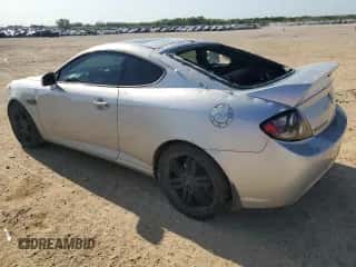 2008 Hyundai Tiburon GT с VIN KMHHN66F28U293287, выставлен на аукционе Copart как лот 52166005 с пробегом 106 072 миль миль и Чистый • Clean title. История ставок и продаж доступна на DreamBid. Изображение 2.