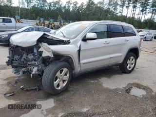 2012 Jeep Grand Cherokee Laredo z VIN 1C4RJEAG7CC236189, wystawiony jako Copart lot #85944985 z przebiegiem Nie podano mil oraz Szkoda całkowita • Salvage title. Historia ofert i sprzedaży dostępna na DreamBid. Obrazek 1.