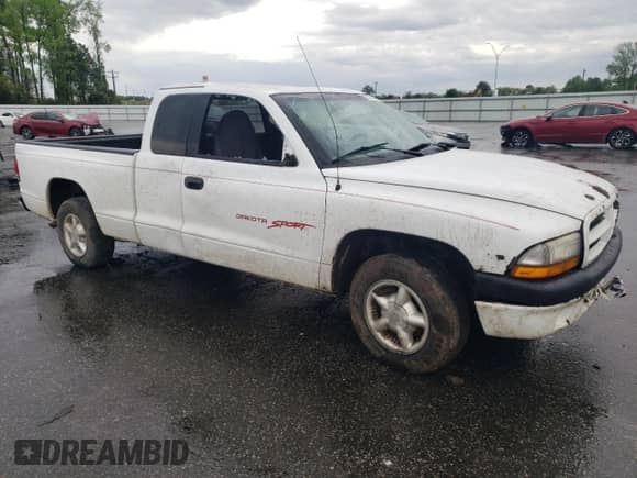 1998 Dodge Dakota SLT с VIN 1B7GL22X6WS693570, выставлен на аукционе Copart как лот 52000825 с пробегом 125 985 миль миль и Списание • Salvage title. История ставок и продаж доступна на DreamBid. Изображение 4.