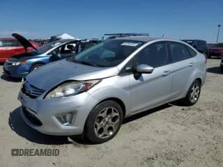 2011 Ford Fiesta SEL with VIN 3FADP4CJ0BM109265, listed as a Copart auction lot 65294495 with 153,973 mi miles and Salvage title. Bid and sale history available at DreamBid. Image 1.