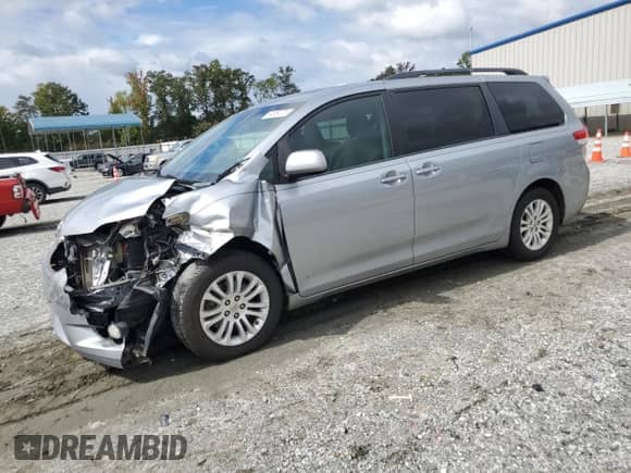 2013 Toyota Sienna XLE AAS with VIN 5TDYK3DC0DS401067, listed as a Copart auction lot 84659005 with 208,465 mi miles and Salvage title. Bid and sale history available at DreamBid. Image 1.