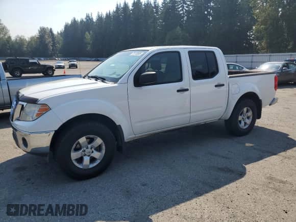 2009 Nissan Frontier SE with VIN 1N6AD07W79C403937, listed as a Copart auction lot 71112695 with 203,010 mi miles and Salvage title. Bid and sale history available at DreamBid. Image 1.