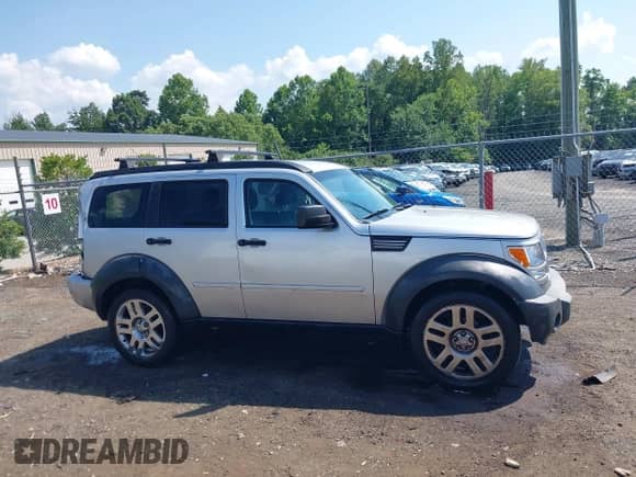 2011 Dodge Nitro Heat with VIN 1D4PT4GX5BW500318, listed as a IAAI auction lot 42602440 with 163,836 mi miles and . Bid and sale history available at DreamBid. Image 13.