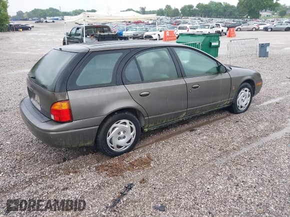 2000 Saturn SW with VIN 1G8ZJ8274YZ132063, listed as a IAAI auction lot 42453187 with 140,166 mi miles and . Bid and sale history available at DreamBid. Image 4.