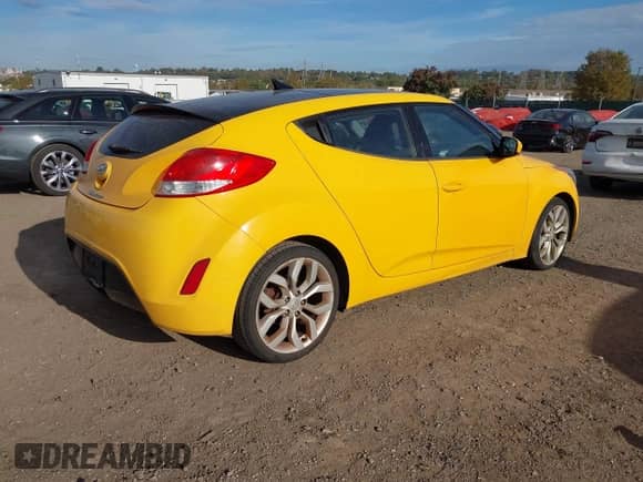 2012 Hyundai Veloster w/Black Int z VIN KMHTC6AD9CU066984, wystawiony jako IAAI lot #43489204 z przebiegiem 180 317 mil mil oraz . Historia ofert i sprzedaży dostępna na DreamBid. Obrazek 4.