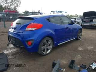 2014 Hyundai Veloster Turbo z VIN KMHTC6AE5EU192822, wystawiony jako IAAI lot #43484645 z przebiegiem 114 938 mil mil oraz . Historia ofert i sprzedaży dostępna na DreamBid. Obrazek 4.