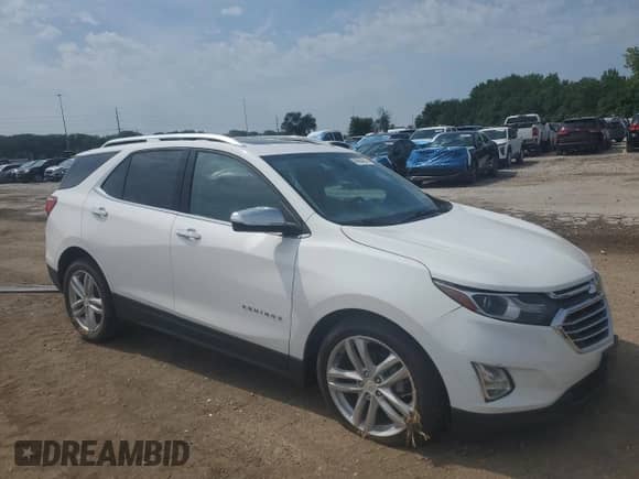 2018 Chevrolet Equinox Premier with VIN 2GNAXVEV1J6115823, listed as a Copart auction lot 69094645 with 106,508 mi miles and Salvage title. Bid and sale history available at DreamBid. Image 4.
