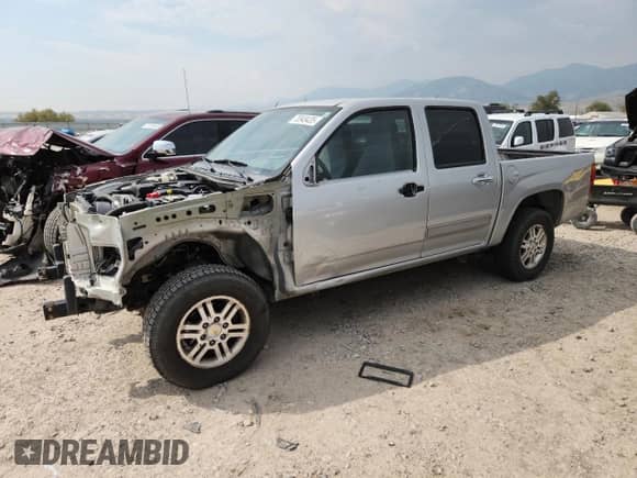 2012 Chevrolet Colorado 1LT with VIN 1GCHTCFEXC8105455, listed as a Copart auction lot 70949435 with 165,212 mi miles and Salvage title. Bid and sale history available at DreamBid. Image 1.