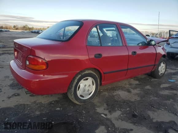 1997 Hyundai Accent GL z VIN KMHVF24N9VU356190, wystawiony jako Copart lot #85610774 z przebiegiem 91 707 mil mil oraz Czysty tytuł • Clean title. Historia ofert i sprzedaży dostępna na DreamBid. Obrazek 3.