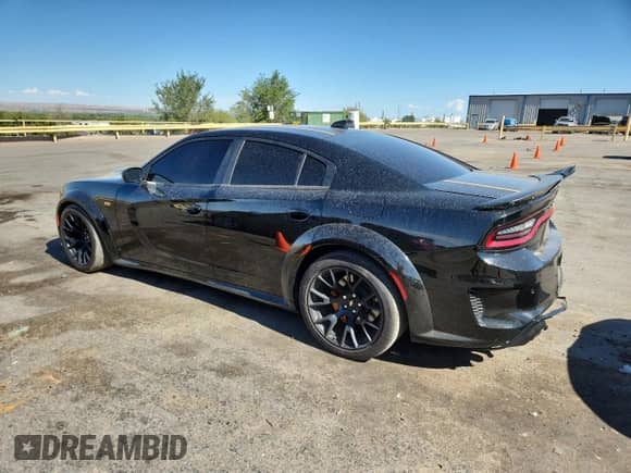 2023 Dodge Charger Scat Pack with VIN 2C3CDXGJ3PH508823, listed as a Copart auction lot 67311025 with 53,871 mi miles and Salvage title. Bid and sale history available at DreamBid. Image 2.