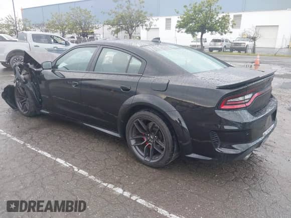 2021 Dodge Charger Scat Pack Widebody with VIN 2C3CDXGJ9MH561070, listed as a IAAI auction lot 41798863 with 62,984 mi miles and . Bid and sale history available at DreamBid. Image 3.