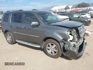 2011 Honda Pilot Touring with VIN 5FNYF3H98BB008714, listed as a IAAI auction lot 43369473 with 63,399 mi miles and . Bid and sale history available at DreamBid. Image 1.