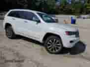 2017 Jeep Grand Cherokee Overland with VIN 1C4RJFCGXHC964499, listed as a Copart auction lot 71671795 with 117,302 mi miles and Salvage title. Bid and sale history available at DreamBid. Image 4.