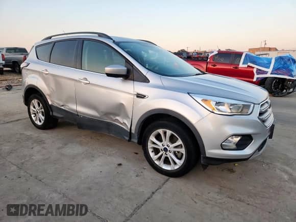 2018 Ford Escape SE with VIN 1FMCU9GD0JUB93710, listed as a Copart auction lot 85751065 with 138,902 mi miles and Salvage title. Bid and sale history available at DreamBid. Image 4.