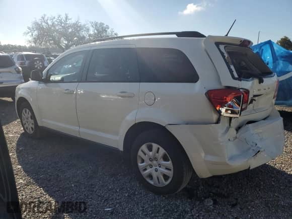 2015 Dodge Journey SE with VIN 3C4PDCAB9FT713785, listed as a Copart auction lot 84352205 with 96,110 mi miles and Salvage title. Bid and sale history available at DreamBid. Image 2.