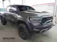 2022 Ram 1500 TRX with VIN 1C6SRFU93NN415194, listed as a IAAI auction lot 42168116 with 33,356 mi miles and . Bid and sale history available at DreamBid. Image 1.