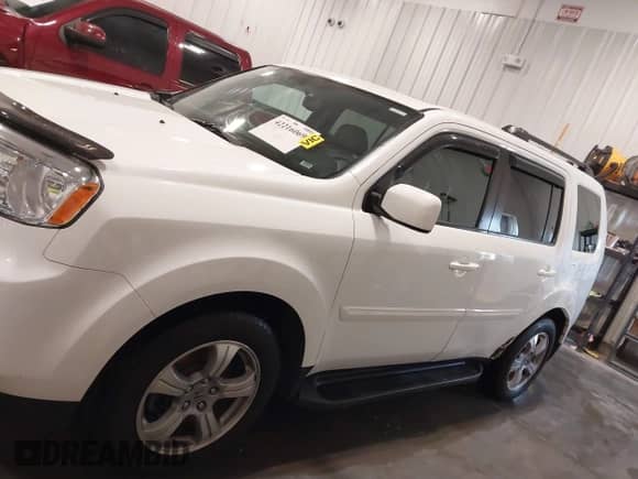 2014 Honda Pilot EX-L with VIN 5FNYF4H5XEB012061, listed as a IAAI auction lot 42216069 with 76,113 mi miles and . Bid and sale history available at DreamBid. Image 14.