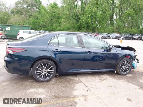 2021 Toyota Camry Hybrid XLE with VIN 4T1F31AK8MU563752, listed as a IAAI auction lot 42134620 with 19,484 mi miles and . Bid and sale history available at DreamBid. Image 14.