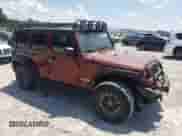 2007 Jeep Wrangler Unlimited Rubicon with VIN 1J4GA69127L155288, listed as a Copart auction lot 64615025 with 176,225 mi miles and Salvage title. Bid and sale history available at DreamBid. Image 4.