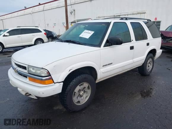 2003 Chevrolet Blazer LS with VIN 1GNDT13X63K145986, listed as a IAAI auction lot 41604061 with 158,431 mi miles and . Bid and sale history available at DreamBid. Image 2.