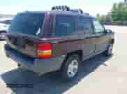 1996 Jeep Grand Cherokee Laredo z VIN 1J4GZ58Y2TC354076, wystawiony jako IAAI lot #42572842 z przebiegiem 172 282 mil mil oraz . Historia ofert i sprzedaży dostępna na DreamBid. Obrazek 4.