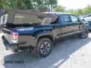 2021 Toyota Tacoma SR5 z VIN 3TYDZ5BN1MT002778, wystawiony jako IAAI lot #42591088 z przebiegiem Nie podano mil oraz . Historia ofert i sprzedaży dostępna na DreamBid. Obrazek 4.
