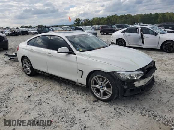 2015 BMW 4 Series 428i z VIN WBA4A5C57FG052581, wystawiony jako Copart lot #84033205 z przebiegiem 76 638 mil mil oraz Szkoda całkowita • Salvage title. Historia ofert i sprzedaży dostępna na DreamBid. Obrazek 4.
