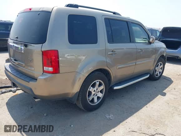 2009 Honda Pilot Touring with VIN 5FNYF38809B004142, listed as a IAAI auction lot 42337103 with 152,874 mi miles and . Bid and sale history available at DreamBid. Image 4.