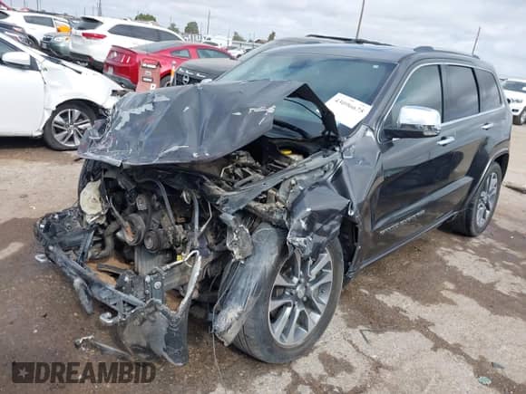 2017 Jeep Grand Cherokee Overland with VIN 1C4RJFCT0HC843199, listed as a IAAI auction lot 43096675 with 119,614 mi miles and . Bid and sale history available at DreamBid. Image 16.