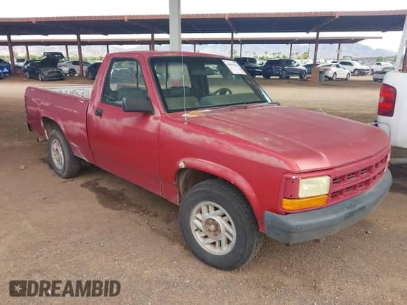 1992 Dodge Dakota SLT z VIN 1B7FL26X1NS681749, wystawiony jako IAAI lot #43093876 z przebiegiem Nie podano mil oraz . Historia ofert i sprzedaży dostępna na DreamBid. Obrazek 1.