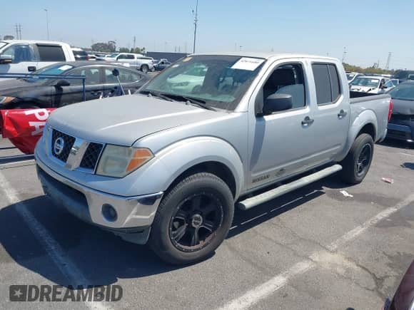 2005 Nissan Frontier SE with VIN 1N6AD07U25C424865, listed as a IAAI auction lot 42871680 with 176,479 mi miles and . Bid and sale history available at DreamBid. Image 2.