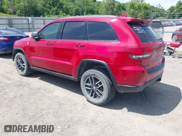 2017 Jeep Grand Cherokee Trailhawk z VIN 1C4RJFLT8HC693715, wystawiony jako IAAI lot #42531133 z przebiegiem 128 250 mil mil oraz . Historia ofert i sprzedaży dostępna na DreamBid. Obrazek 3.