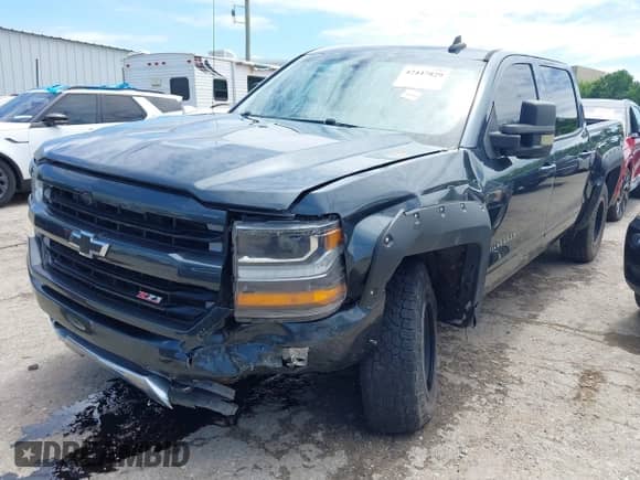 2017 Chevrolet Silverado 1500 LT with VIN 3GCUKREC5HG227940, listed as a IAAI auction lot 42447829 with 130,557 mi miles and . Bid and sale history available at DreamBid. Image 2.