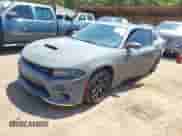 2018 Dodge Charger R/T with VIN 2C3CDXCT7JH163889, listed as a IAAI auction lot 43058281 with 166,161 mi miles and . Bid and sale history available at DreamBid. Image 2.